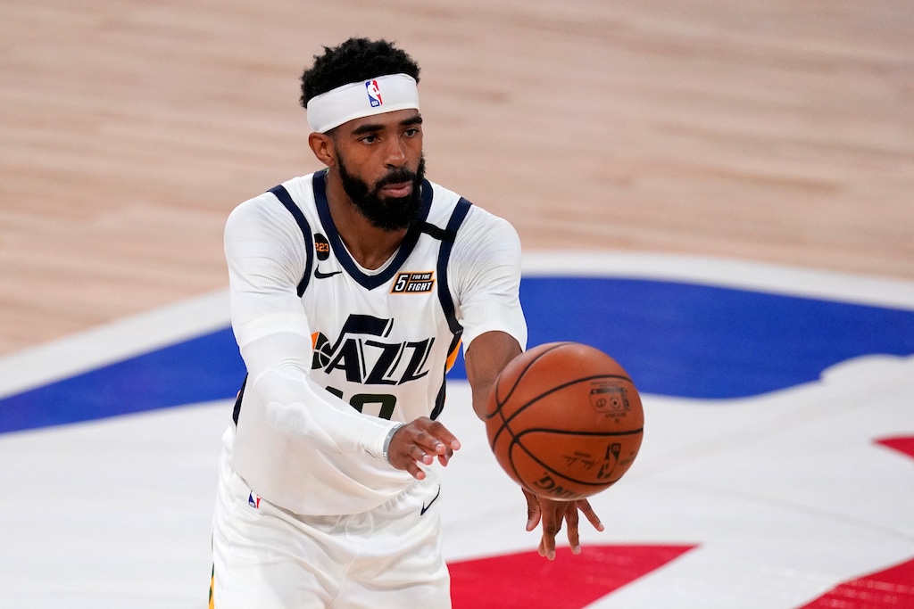 Utah Jazz's Mike Conley (10) makes a pass during the second half an NBA first round playoff basketball game against the Denver Nuggets on Tuesday, Sept. 1,2020, in Lake Buena Vista, Fla. (AP Photo/Mark J. Terrill)