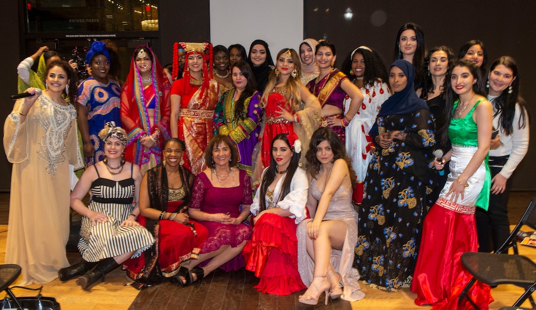 (Rick Egan  |  The Salt Lake Tribune)     Runway models pose for a photo with Samira Harnish, Founder & Executive Director of Women of the World, at the 9th annual Women of the World Fashion Show Gala, Wednesday, March 6, 2019.