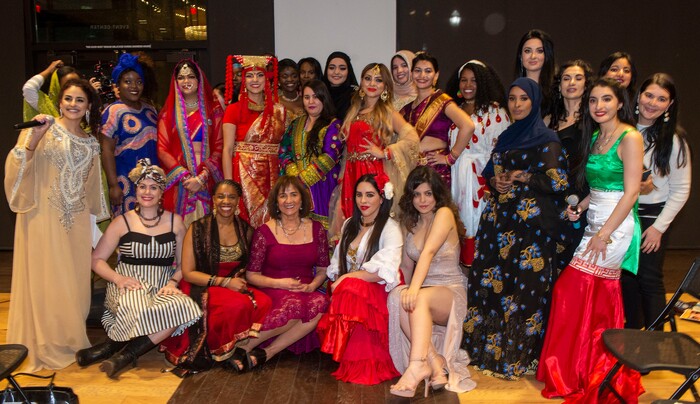 (Rick Egan | The Salt Lake Tribune) Runway models pose for a photo with Samira Harnish, Founder & Executive Director of Women of the World, at the 9th annual Women of the World Fashion Show Gala, Wednesday, March 6, 2019.