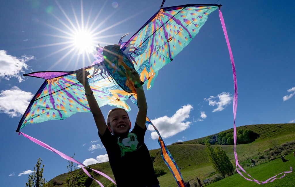 (Francisco Kjolseth | The Salt Lake Tribune) Brayden Taylor, 8, gets ready to launch his dragon kite during a kite festival at Tunnel Springs Park in North Salt Lake on Saturday, May 8, 2021. Warmer than average temperatures are expected in Utah this weekend.