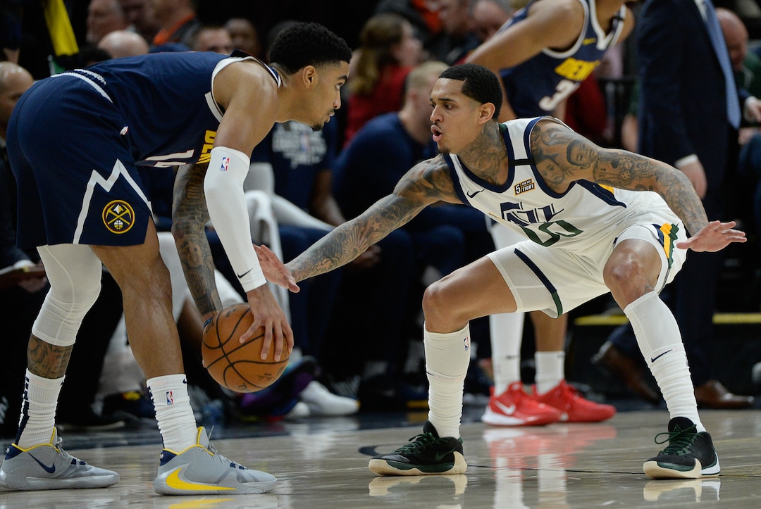 (Francisco Kjolseth  |  The Salt Lake Tribune) Denver Nuggets guard Gary Harris (14) goes up against Utah Jazz guard Jordan Clarkson (00) as the Utah Jazz host the Denver Nuggets in their NBA basketball game at Vivint Smart Home Arena in Salt Lake City on Wednesday, Feb. 5, 2020.