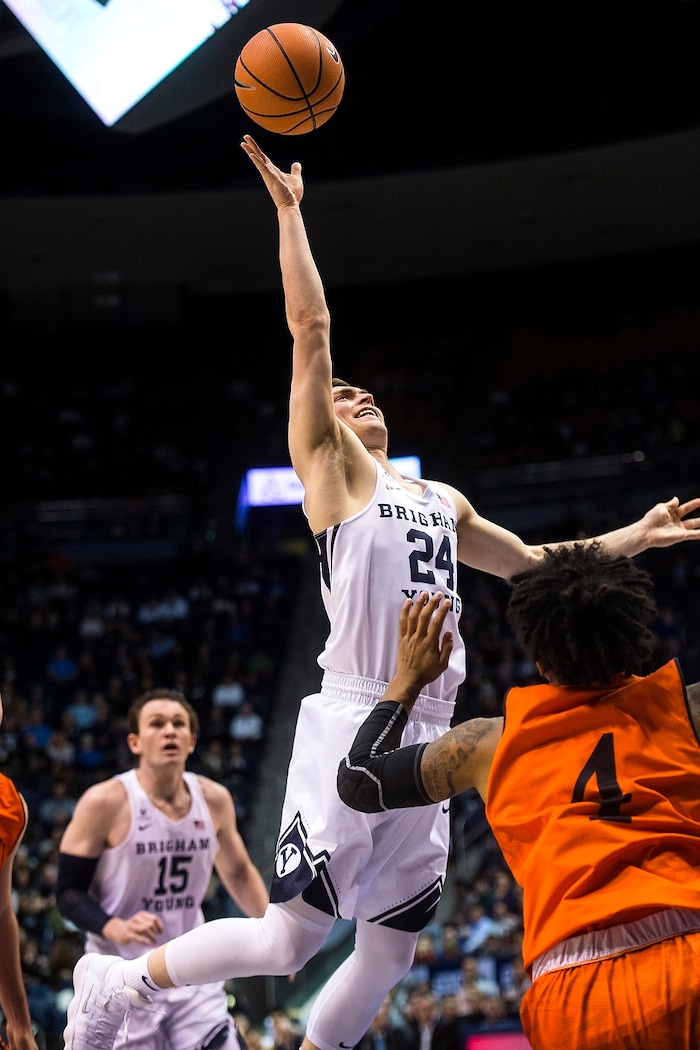 (Chris Detrick  |  The Salt Lake Tribune)  Brigham Young Cougars guard McKay Cannon (24) shoots past Idaho State Bengals guard Sam Dowd (4) during the game at the Marriott Center Thursday, December 21, 2017.  