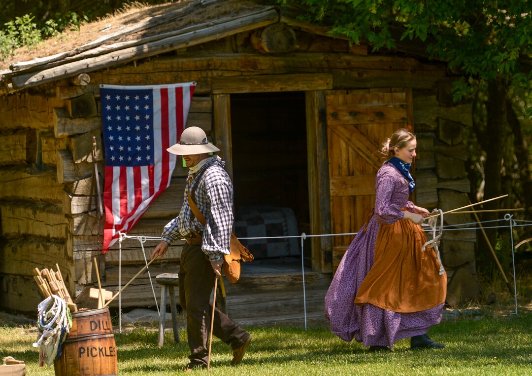 (Leah Hogsten  |  The Salt Lake Tribune) Brian Jenkins plays graces, a mid-1800s game with his co-worker Brianne Miller, during Pioneer Day festivities at the American West Heritage Center in Wellsville, July 24, 2020.