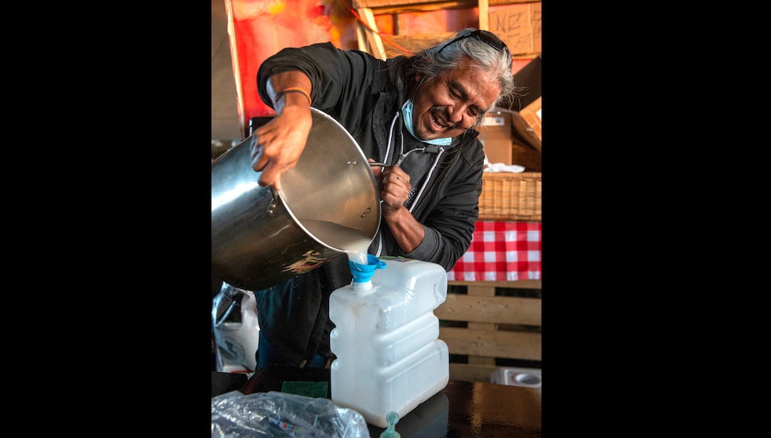 (Rick Egan | The Salt Lake Tribune) Dave John, a volunteer with the nonprofit group PANDOS, cooks meals at Camp Last Hope on Saturdays and Sundays. Saturday, Jan. 2, 2021.