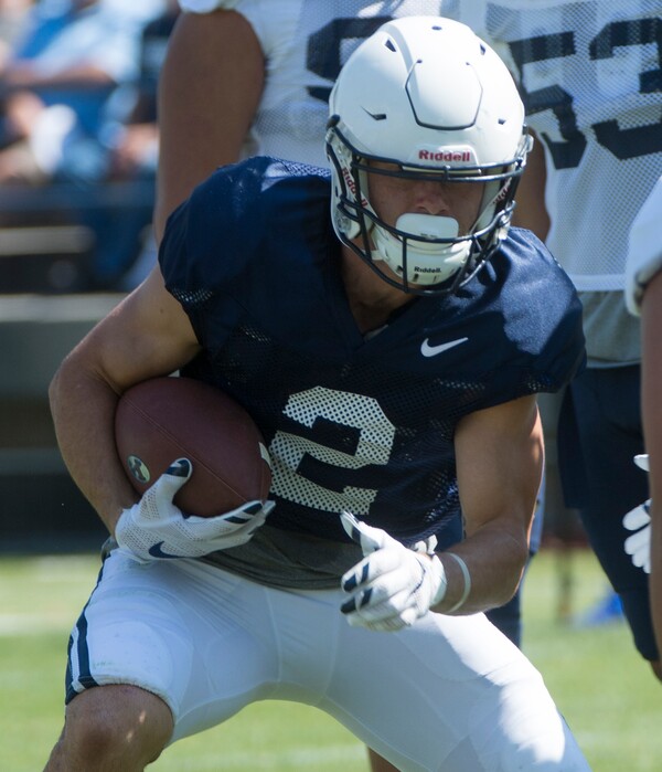 (Rick Egan  |  The Salt Lake Tribune)  Austin Kafentzis runs with the ball during a scrimmage at Lavell Edwards Stadium.