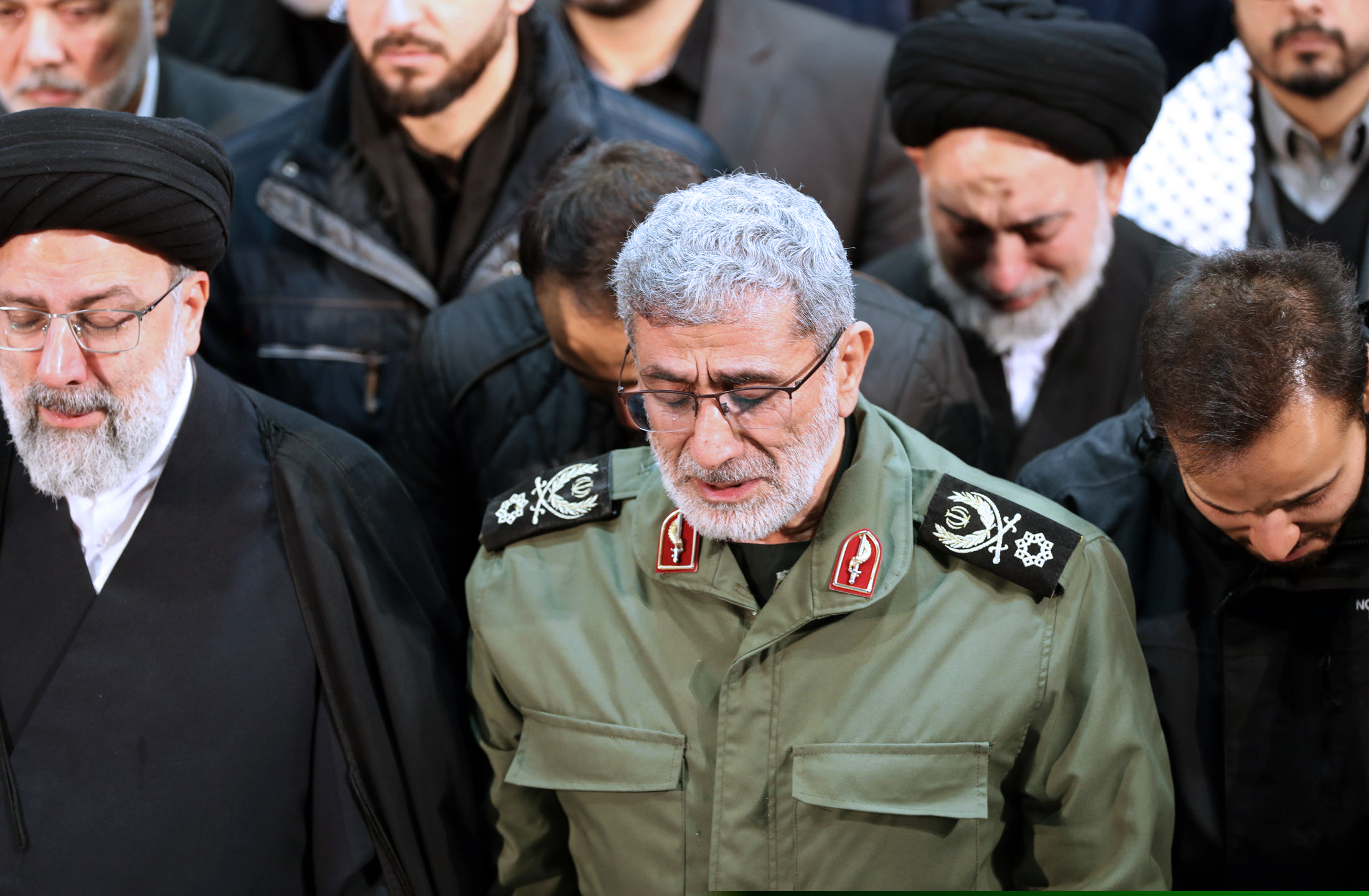 (Office of the Iranian Supreme Leader via AP) In this photo released by the official website of the Office of the Iranian Supreme Leader, Gen. Esmail Ghaani, newly appointed commander of Iran's Revolutionary Guards Quds Force, weeps while praying over the coffin of the force's previous head Gen. Qassem Soleimani at the Tehran University Campus in Tehran, Iran, Monday, Jan. 6, 2020. Soleimani was killed Friday, Jan. 3 in a U.S. drone attack in Iraq.