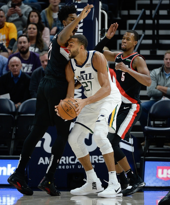 (Francisco Kjolseth  |  The Salt Lake Tribune)  Utah Jazz center Rudy Gobert (27) is blocked by the Trailblazers as the Utah Jazz host the Portland Trailblazers in their NBA basketball game at Vivint Smart Home Arena in Salt Lake City on Wed. Oct. 16, 2019.