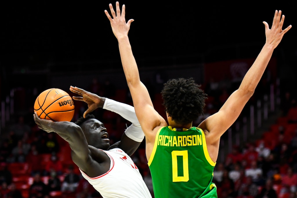 Utah guard Both Gach, left, shoots against Oregon guard Will Richardson (0) during the second half of an NCAA college basketball game Saturday, Feb. 5, 2022, in Salt Lake City. (AP Photo/Alex Goodlett)