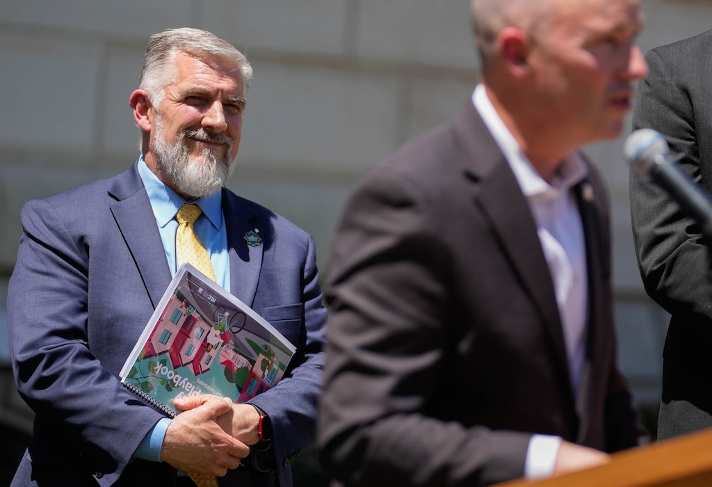 (Francisco Kjolseth | The Salt Lake Tribune) Mayor Mark Shepherd, left, of Clearfield, joins the governor along with mayors and government officials from around the state for a housing summit titled “Built Here,” to focus on building 35,000 new starter homes in the state, Thursday, May 29, 2025.