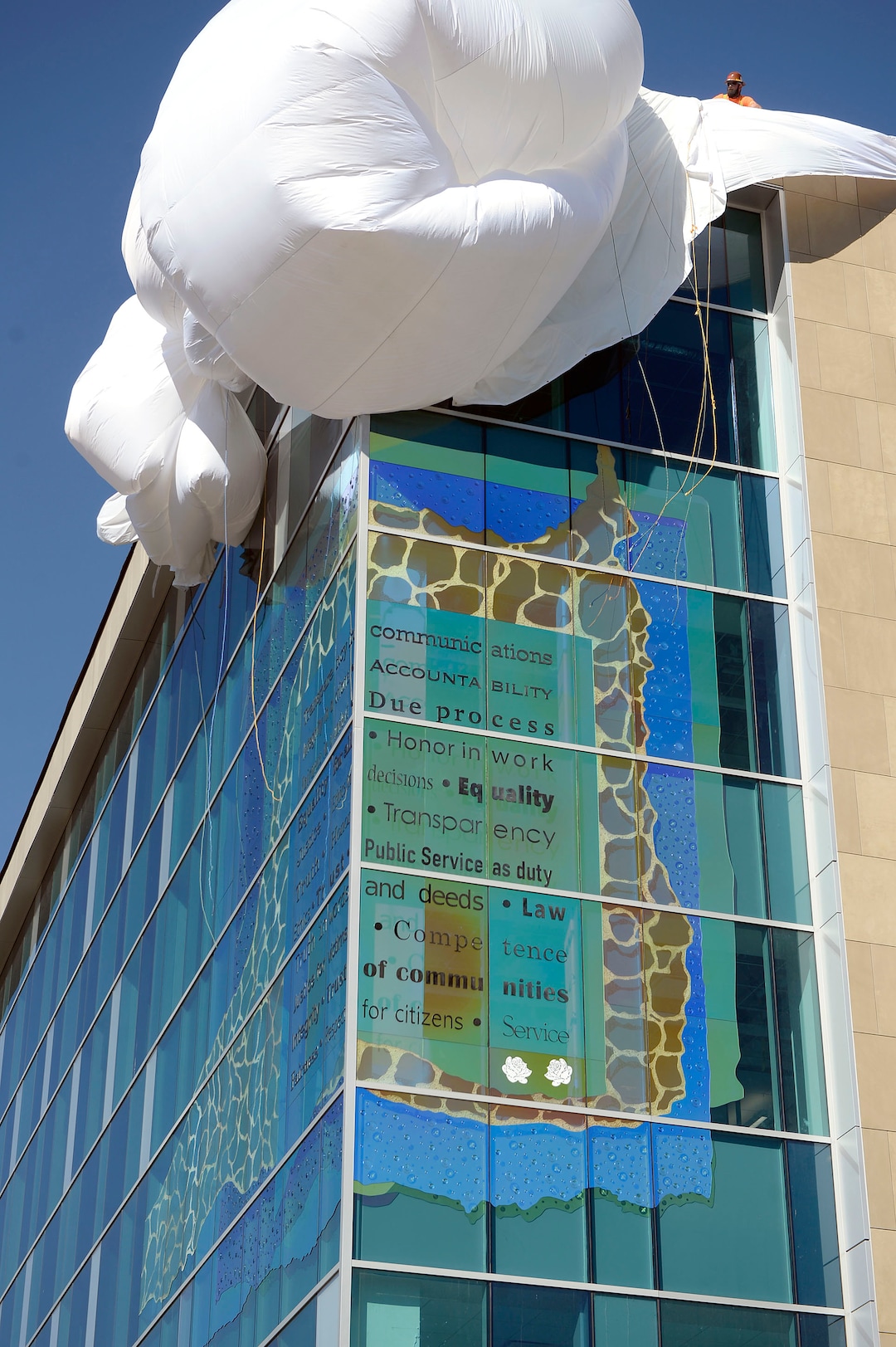 (Al Hartmann  |  The Salt Lake Tribune) 	New glass art covering the façade of the downtown District Attorney building at 35 E. 500 S. is unveiled Wednesday September 27.   The glass artwork is complete, but the building is currently under construction to be completed in Spring 2018.  