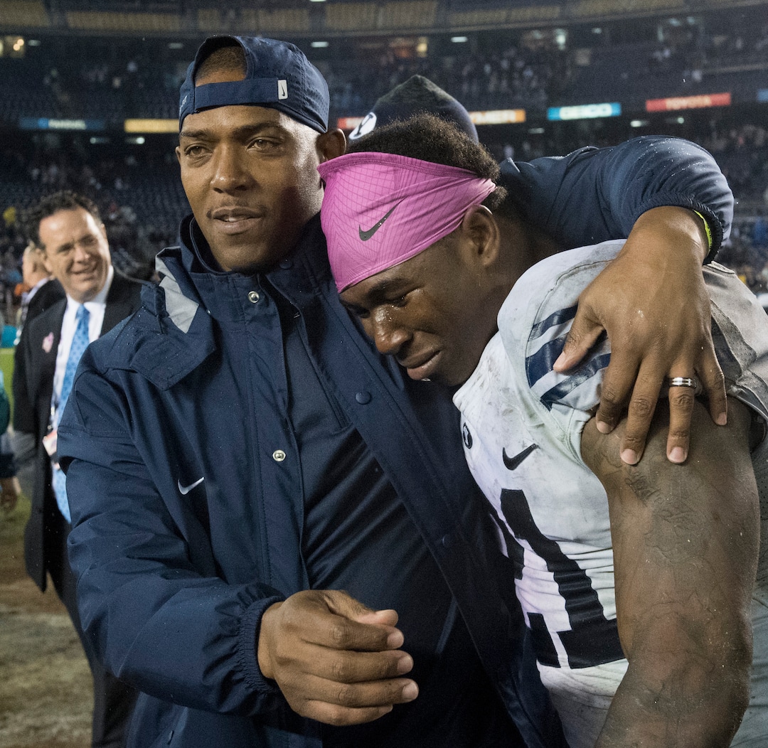 Rick Egan  |  The Salt Lake TribuneBrigham Young cornerbacks coach, Jernaro Gilford walks off the field with Brigham Young Cougars running back Jamaal Williams (21), who rushed for 210 yards, and won the offensive MVP trophy, as BYU defeated Wyoming 24-21in the Poinsettia Bowl, at Qualcomm Stadium in San Diego, December 21, 2016.