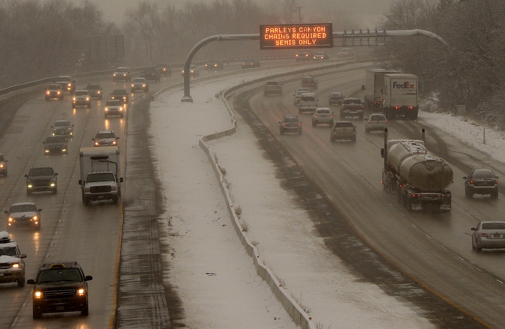 Al Hartmann | The Salt Lake Tribune
Commuters endure a messy commute along I-80 near the mouth of Parley's Canyon Monday Dec. 29, 2014. Advisory sign flashes that chains are required for semis traveling up the canyon. UDOT has created a social media channel geared toward Park City-area skiers and snowboarders that will alert them to issues in the canyon as well as four other major arteries to Deer Valley Resort and Park City Mountain. It is expected to begin posting Jan. 22, 2025.