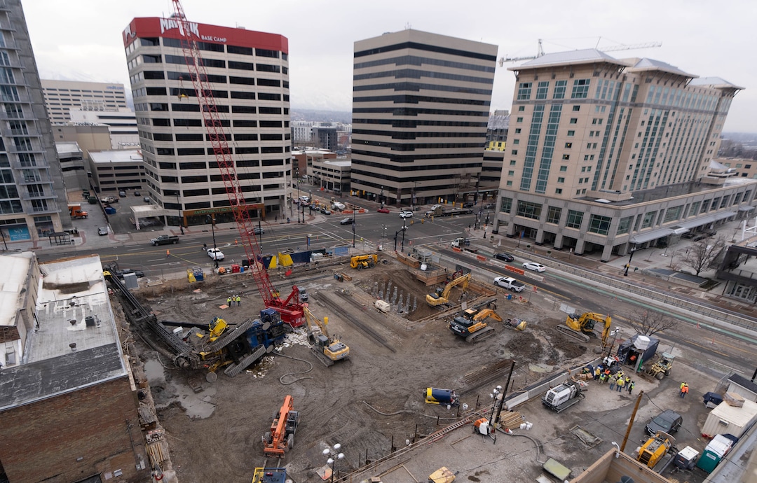 (Francisco Kjolseth | The Salt Lake Tribune) A collapsed drill rig is seen on Wednesday, March 16, 2022, at the intersection of State Street and 200 South. The rig toppled over Tuesday night at the site of the new Astra Tower, crushing two unoccupied parked cars and sending the crane operator to the hospital in serious condition.