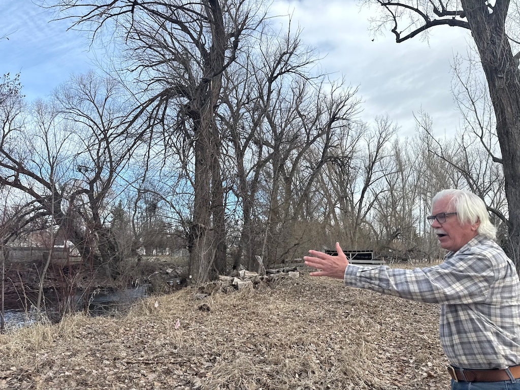 (Clarissa Casper | The Salt Lake Tribune) Michael Jablonski gestures toward his land, which surrounds the Logan River and is at risk of being paved due to a proposed UDOT project aimed at reducing traffic on Main Street in Cache County.