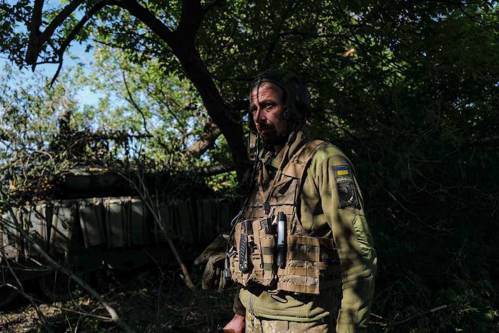 (Lynsey Addario | The New York Times) 

A Ukrainian soldier with a captured Russian T-80BVM main battle tank in Hrushuvakha, on the road west of Izyum in the Kharkiv region of Ukraine, May 12, 2022.