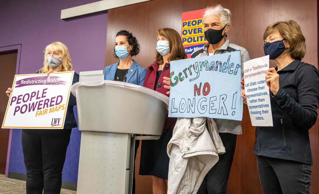(Leah Hogsten | The Salt Lake Tribune Rep. Suzanne Harrison, D-Draper and Sen. Kathleen Riebe, D-Cottonwood Heights, center, pose with concerned Utah voters Teresa Carlson, left, Marilyn Bown and Helen Moser who are concerned about possible partisan gerrymandering of the redrawing of redistricting lines. Riebe was joined by Sen. Derek Kitchen, D-Salt Lake City and  to emphasize the importance of the will of the voters in drawing new lines in the redistricting process, Aug. 19, 2021 at the Millcreek Library. 