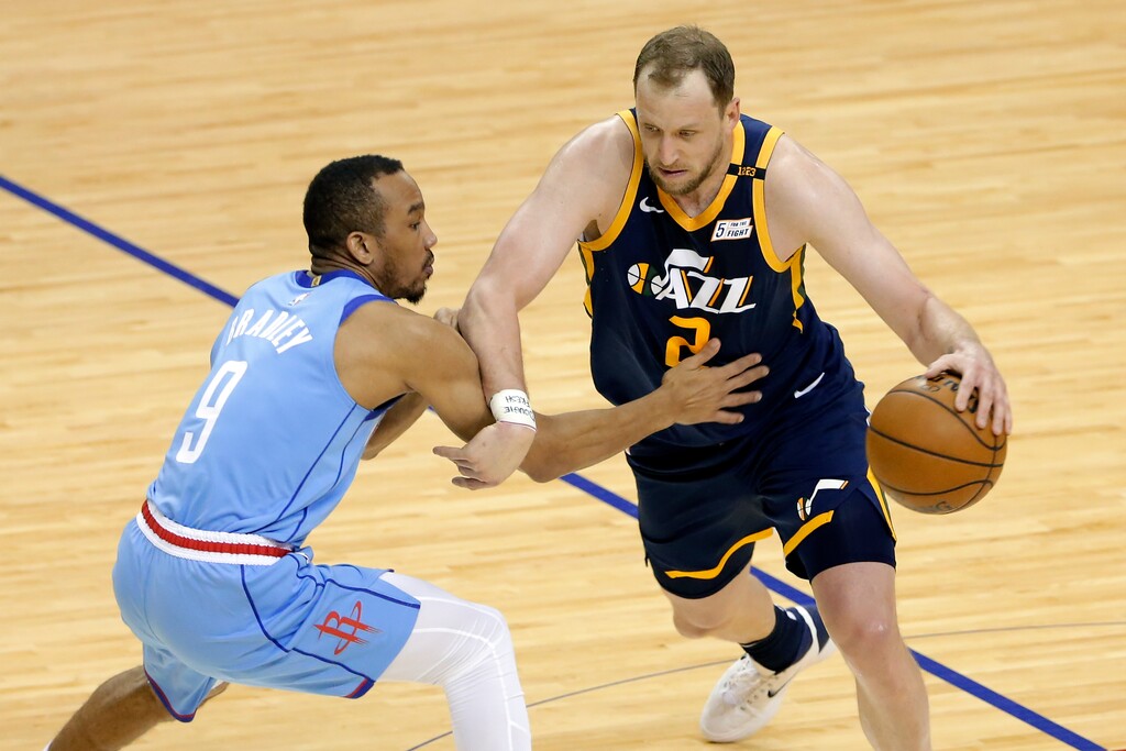 Utah Jazz guard Joe Ingles (2) drives around Houston Rockets guard Avery Bradley (9) during the second half of an NBA basketball game Wednesday, April 21, 2021, in Houston. (AP Photo/Michael Wyke, Pool)