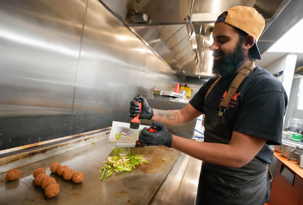 (Francisco Kjolseth | The Salt Lake Tribune) Suvin Sukesh prepares a Falafel Philly at Urban Gyro & Chicken on Regent Street, Friday, Oct. 31, 2025.