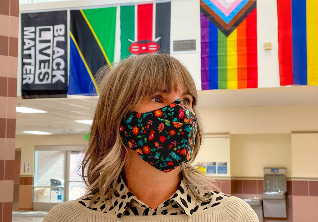 (Trent Nelson | The Salt Lake Tribune) Rose Park Elementary Principal Nicole Palmer in the school's atrium, where an LGBTQ pride flag and a Black Lives Matter flag hang on Thursday, Dec. 10, 2020. Salt Lake City School District allows the flags. It's northern neighbor, Davis School District, does not.