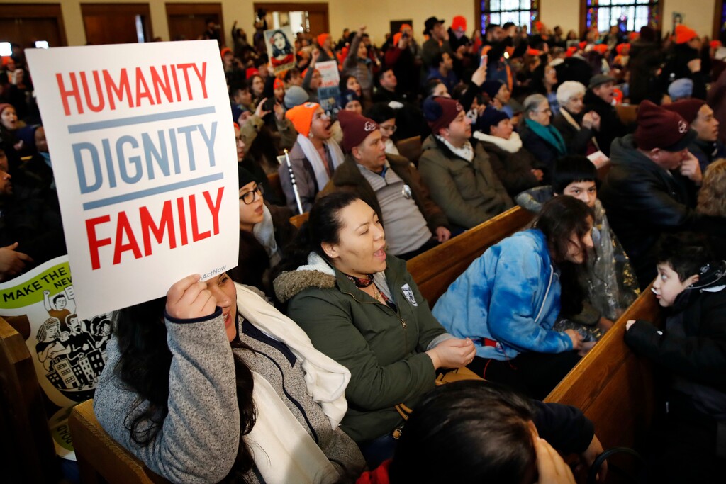 People rally in support of the Deferred Action for Childhood Arrivals program Wednesday, Feb. 7, 2018, at the Lutheran Church of the Reformation, near the Capitol in Washington. (AP Photo/Jacquelyn Martin)