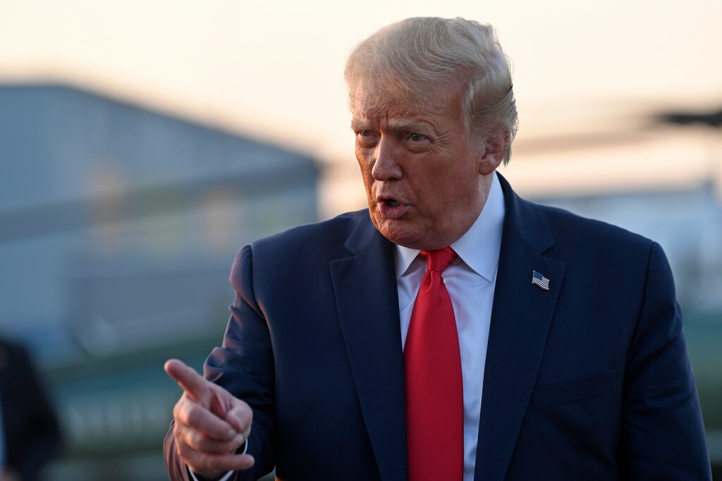 (Susan Walsh | AP file photo) President Donald Trump talks with reporters before departing from Morristown Municipal Airport in Morristown, N.J., Sunday, Aug. 9, 2020. Trump was returning to Washington after spending the weekend at Trump National Golf Club.