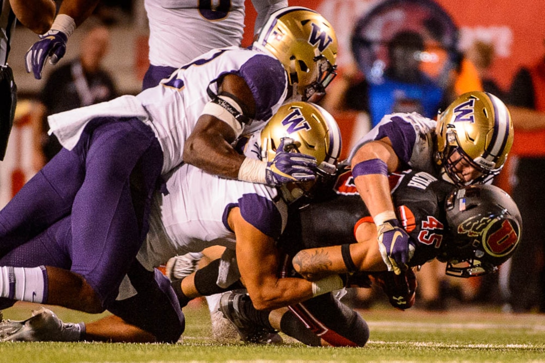(Trent Nelson | The Salt Lake Tribune)  Utah Utes wide receiver Samson Nacua (45) is tackled as the University of Utah hosts Washington at Rice-Eccles Stadium in Salt Lake City, Saturday Sept. 15, 2018.