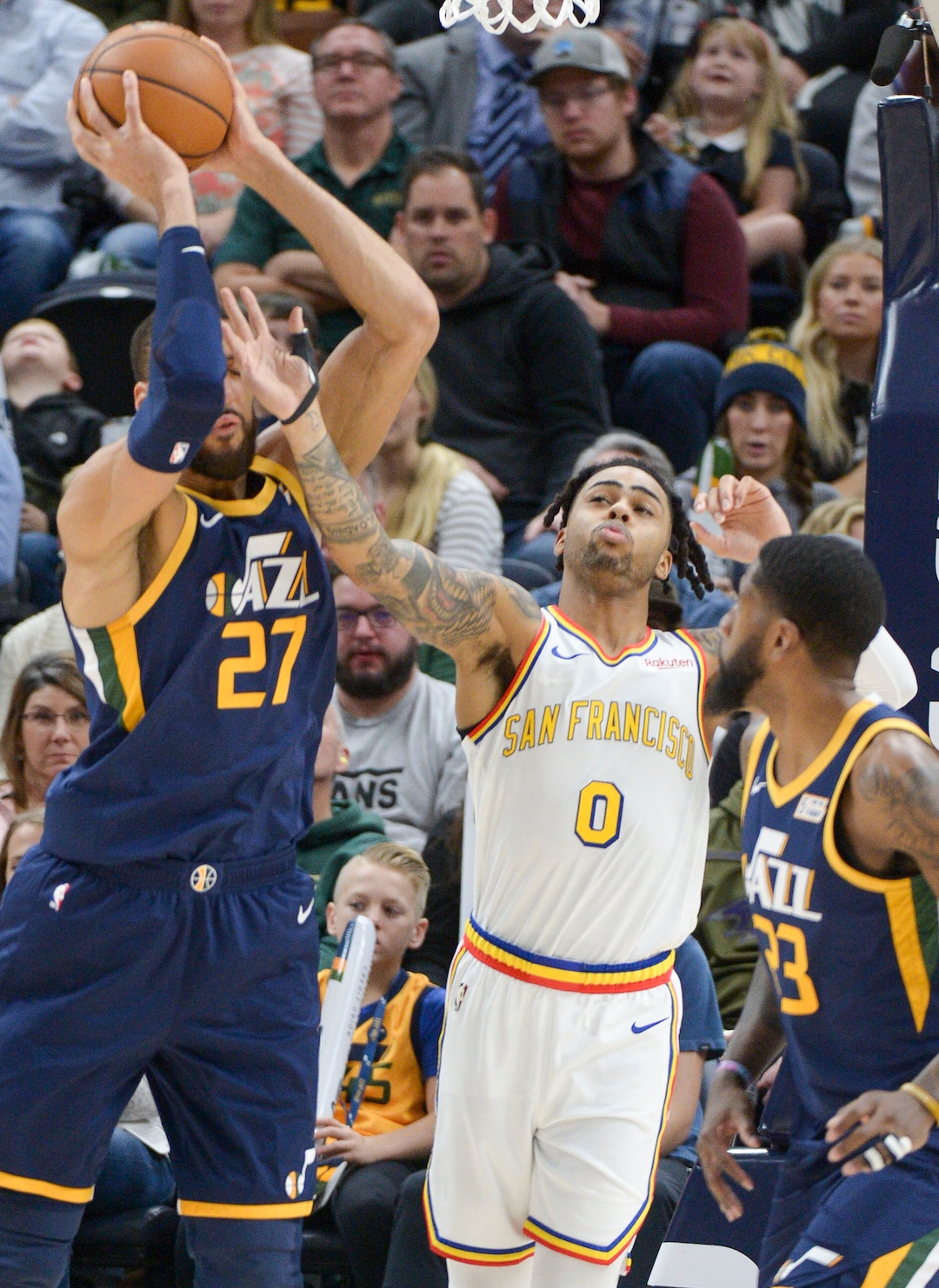 (Leah Hogsten  |  The Salt Lake Tribune) Golden State Warriors guard D'Angelo Russell (0) fouls Utah Jazz center Rudy Gobert (27) as the Utah Jazz host the Golden State Warriors, Dec. 13, 2019 at Vivint Arena.