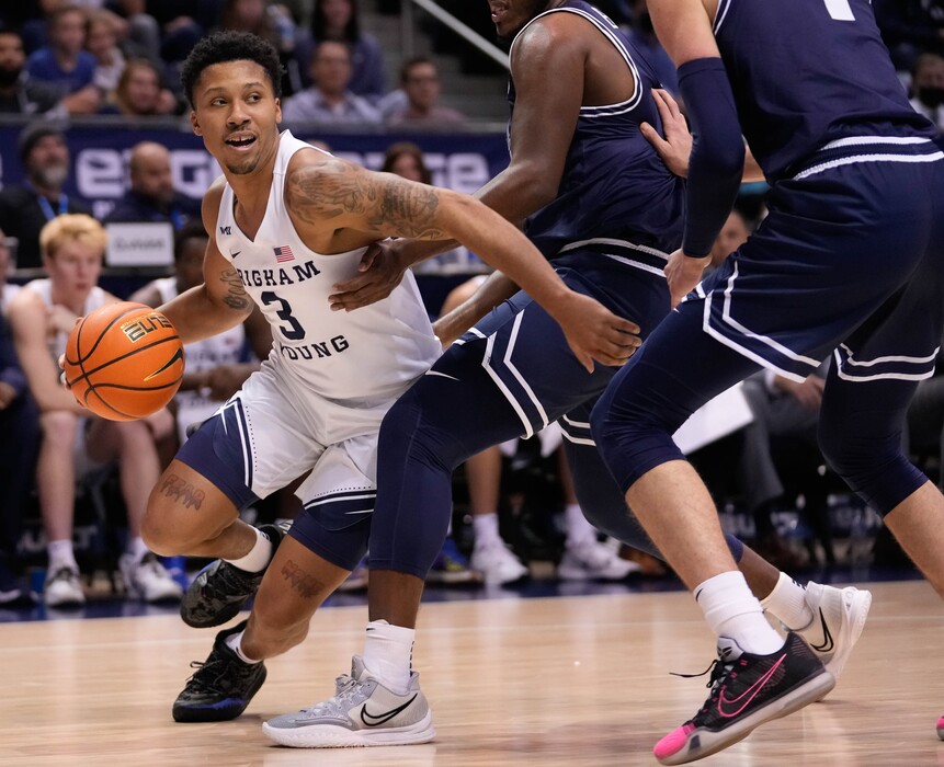 (Francisco Kjolseth | The Salt Lake Tribune) Brigham Young Cougars guard Te'Jon Lucas (3) pushes past the defense in basketball action between the Brigham Young Cougars and the Utah State Aggies at the Marriott Center in Provo, Wednesday, Dec. 8, 2021.