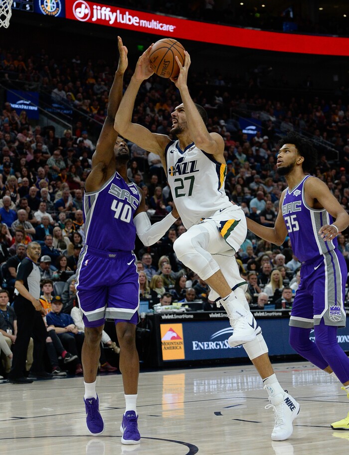 (Francisco Kjolseth  |  The Salt Lake Tribune)  Utah Jazz center Rudy Gobert (27) pushes past Sacramento Kings forward Harrison Barnes (40) as the Utah Jazz host the Sacramento Kings in their NBA game at Vivint Smart Home Arena Friday, April 5, 2019, in Salt Lake City.