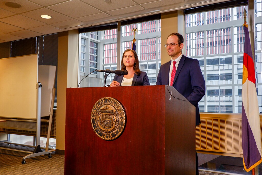 (Jesse Paul | The Colorado Sun, via AP) Colorado Secretary of State Jena Griswold, left, and Attorney General Phil Weiser, right, announce they have asked the U.S. Supreme Court to consider an appeals court ruling that presidential electors can vote for the candidate of their choice, at a news conference in Denver, Colorado on Wednesday, Oct. 16, 2019. Griswold and Weiser insist that presidential electors are bound to cast their votes at the Electoral College according to the popular vote in their respective states.