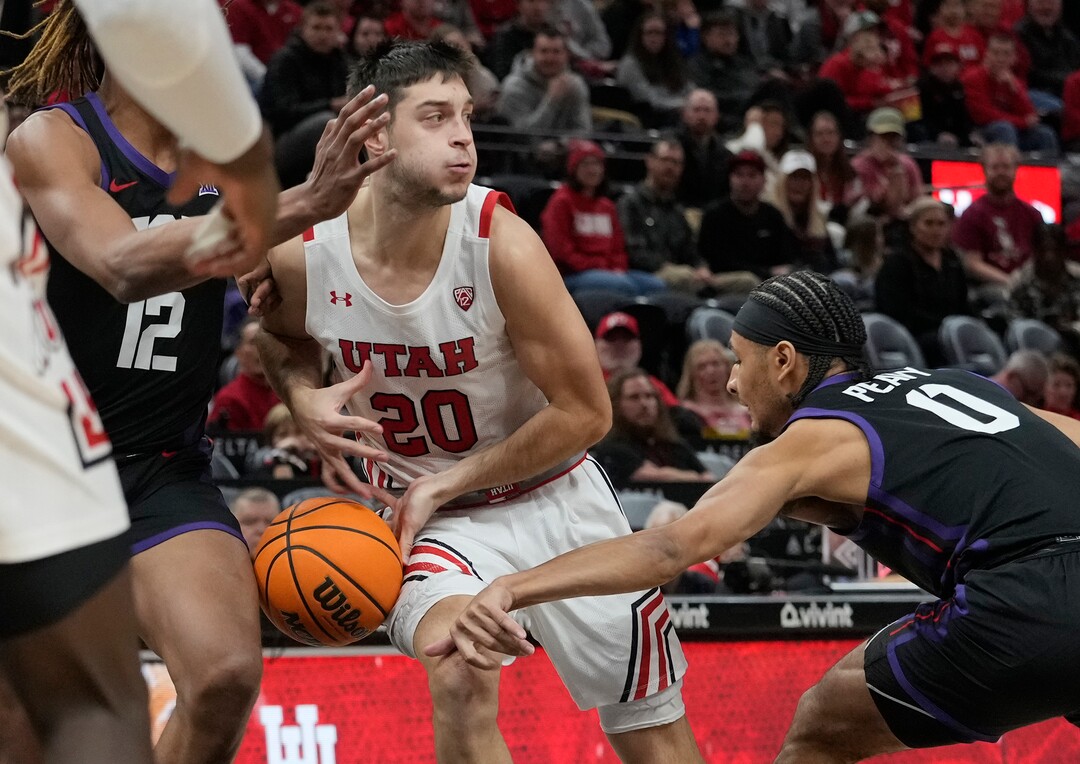 (Leah Hogsten | The Salt Lake Tribune) Utah Utes guard Lazar Stefanovic (20) gets the ball stripped away as the University of Utah hosts the TCU Horned Frogs at Vivint Arena, Dec. 21, 2022. 