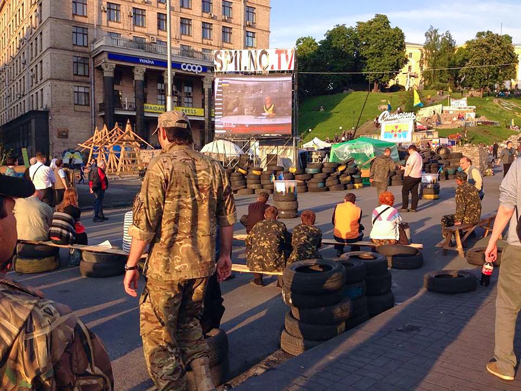 (Eli McCann) People gather at a protest site after the Euromaidan protests in Kyiv, Ukraine, in May 2014.