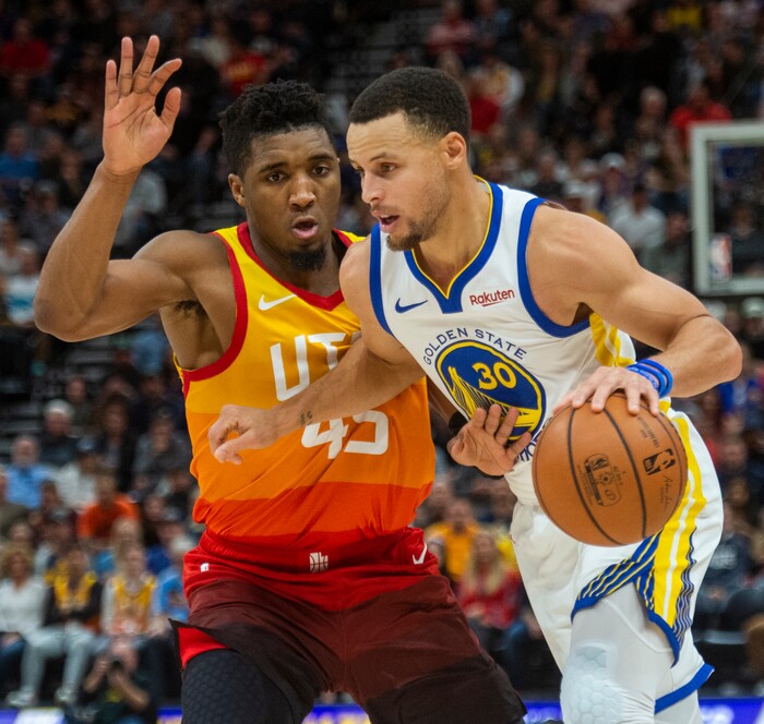 (Rick Egan  |  The Salt Lake Tribune)    Golden State Warriors guard Stephen Curry (30) takes the ball down the lane, as Utah Jazz guard Donovan Mitchell (45) defends, in NBA action between Utah Jazz and Golden State Warriors, in Salt Lake City, Wednesday, Dec. 19, 2018.


