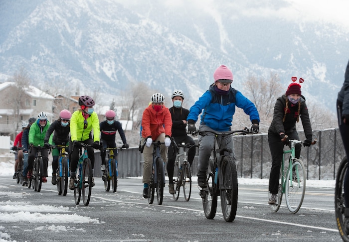 (Francisco Kjolseth  | The Salt Lake Tribune) Fresh snow blankets the mountains as people participate in a memorial bike ride along Wasatch Blvd in Salt Lake City on Sunday, Feb. 14, 2021, in honor of the four who died in an avalanche on Saturday, Feb. 6.
