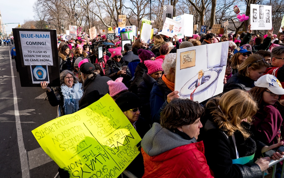 People line up on Central Park West as they wait for the start of a march highlighting equal rights and equality for women Saturday, Jan. 20, 2018, in New York.  The New York protest was among more than 200 such actions planned for the weekend around the world. (AP Photo/Craig Ruttle)