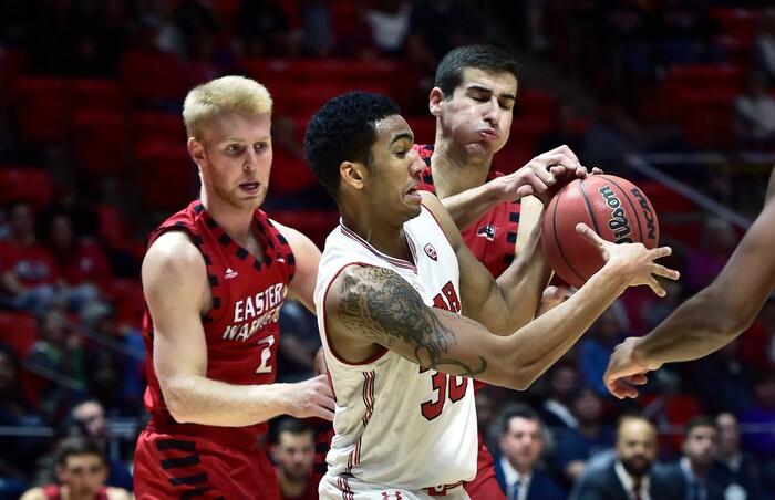(Scott Sommerdorf   |  The Salt Lake Tribune)   Utah's Gabe Bealer battles for control of a loose ball during first half play. Utah defeated Eastern Washington 85-69, Friday, November 24, 2017. 
