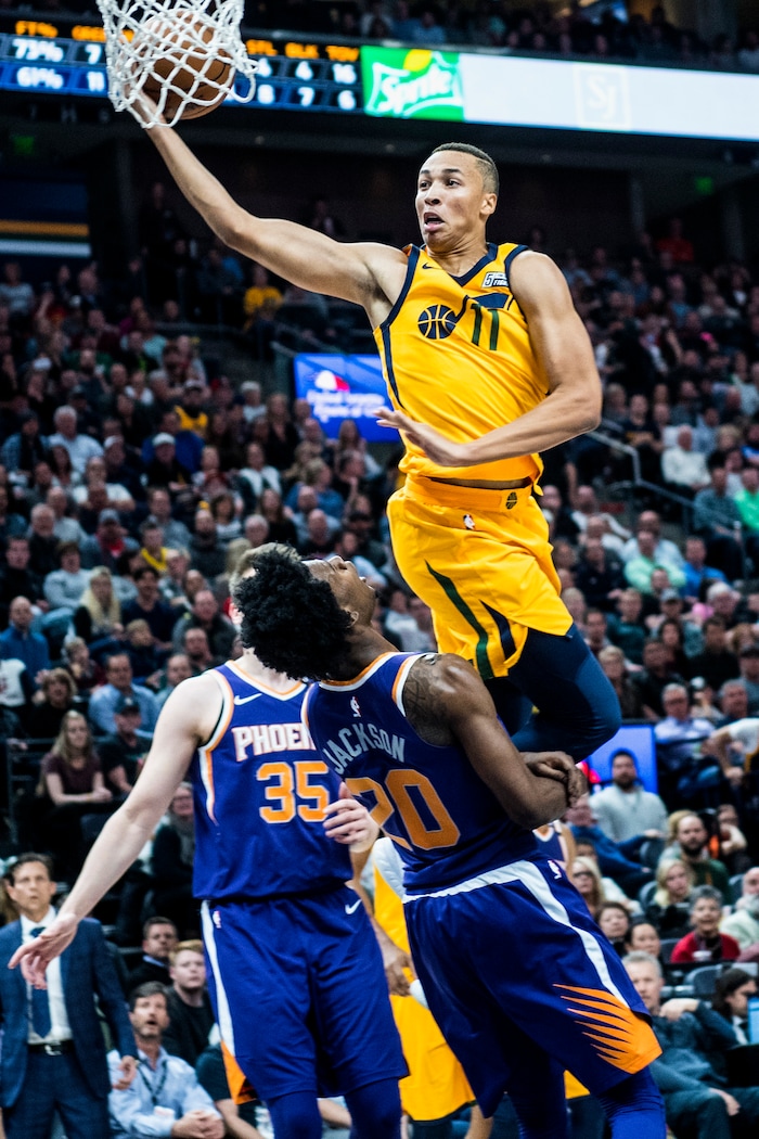 (Chris Detrick  |  The Salt Lake Tribune)  Utah Jazz guard Dante Exum (11) fouls Phoenix Suns guard Josh Jackson (20) during the game at Vivint Smart Home Arena Thursday, March 15, 2018. Utah Jazz defeated Phoenix Suns 116-88.