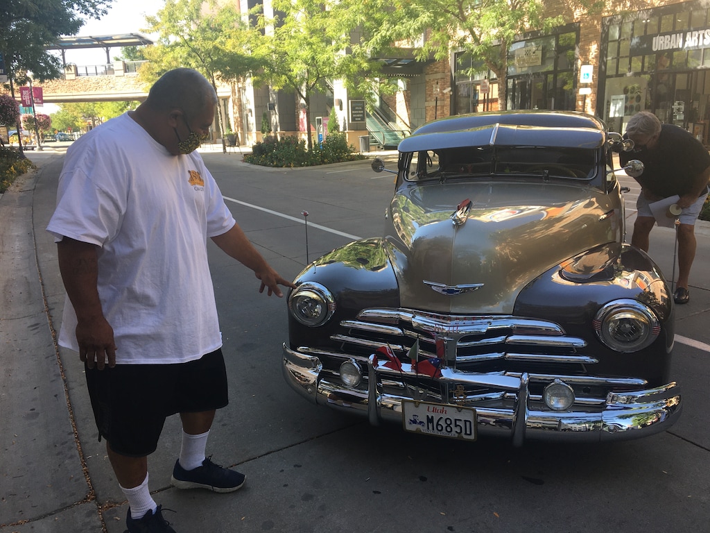 (Sean P. Means  |  The Salt Lake Tribune) Sione Vea, a member of the USO Car Club, shows off details on his restored 1948 Chevrolet Fleetline, on Rio Grande Street at The Gateway in Salt Lake City, Aug. 13, 2020. Lowriders and classic cars like Vea's will be on display at The Gateway on Sept. 6 — one of the events of the 10th annual Urban Arts Festival, which will be broken into "elements" for safe viewing amid the COVID-19 pandemic.