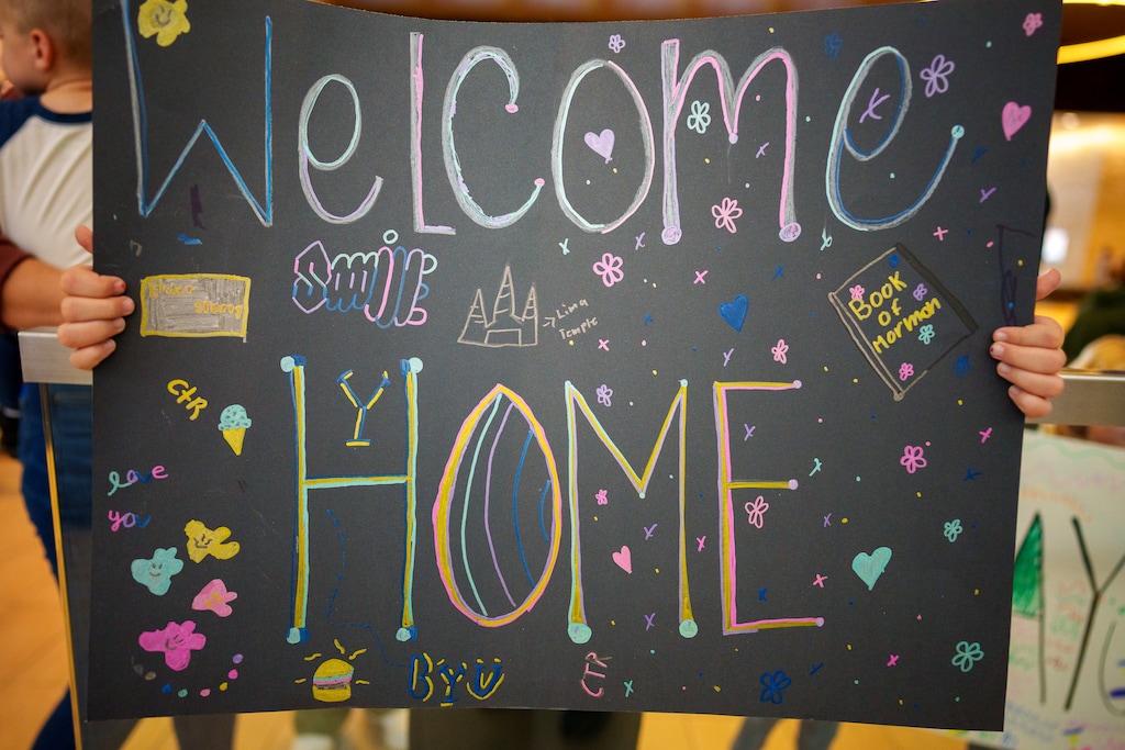 (Trent Nelson | The Salt Lake Tribune) A sign greets a returning missionary at the Salt Lake City International Airport. A church program is designed to help these returnees adjust to life back home.
