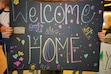 (Trent Nelson | The Salt Lake Tribune) A sign greets a returning missionary at the Salt Lake City International Airport. A church program is designed to help these returnees adjust to life back home.