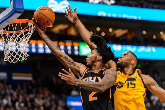 (Trent Nelson | The Salt Lake Tribune)  Phoenix Suns guard Elfrid Payton (2) drives on Utah Jazz forward Derrick Favors (15) as the Utah Jazz host the Phoenix Suns, NBA basketball in Salt Lake City, Wednesday Feb. 14, 2018.