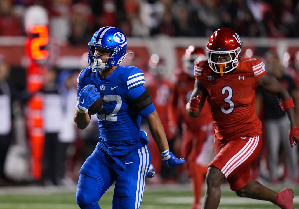 (Bethany Baker  |  The Salt Lake Tribune) Brigham Young Cougars running back LJ Martin (27) runs the ball during the game between the Utah Utes and the Brigham Young Cougars at Rice-Eccles Stadium in Salt Lake City on Saturday, Nov. 9, 2024.