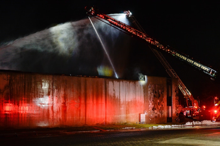 (Francisco Kjolseth | The Salt Lake Tribune) Crews from multiple agencies battled a fire Sunday night that broke out at South Valley Specialties at 9320 S. 547 West in Sandy. The building, where the company makes custom rubber moldings and other products, was declared a complete loss. The cause of the blaze is under investigation.