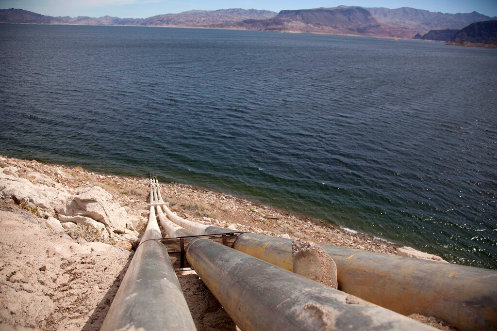 (Julie Jacobson | AP file photo) This March 23, 2012, file photo, shows pipes extending into Lake Mead well above the high water mark near Boulder City, Nev. Six states in the U.S. West that rely on the Colorado River to sustain cities and farms rebuked a plan to build an underground pipeline that would transport billions of gallons of water through the desert to southwest Utah. In a joint letter Tuesday, Sept. 8, 2020, water officials from Arizona, California, Colorado, Nevada, New Mexico and Wyoming urged the U.S. government to halt the approval process for the project, which would bring water 140 miles (225 km) from Lake Powell in northern Arizona to the growing area surrounding St. George, Utah.