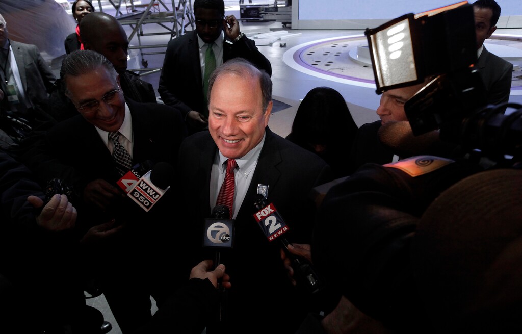 Detroit Mayor Mike Duggan speaks on the floor of the upcoming North American International Auto Show in Detroit, Thursday, Jan. 8, 2015. (AP Photo/Paul Sancya)  