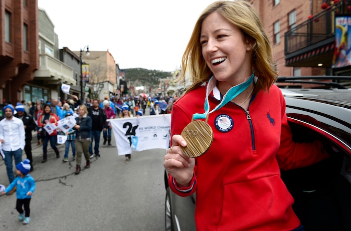 Scott Sommerdorf | The Salt Lake Tribune
Brita Sigourney, Olympic Bronze medalist, Freeskiing/Halfpipe at the 2018 Olympics, shows her medal while riding in Park City's Olympic and Paralympic parade down Main Street, Friday, April 6, 2018. The parade celebrates the accomplishments of Park City-based Olympians. Local athletes wrapped up the PyeongChang Winter Games by earning one silver and two bronze medals.
