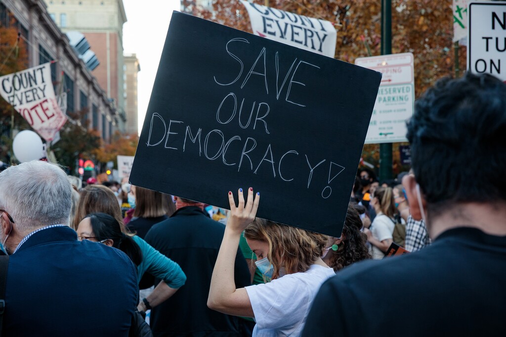 (Damon Winter | The New York Times) Protesters gather outside the Pennsylvania Convention Center in Philadelphia, Nov. 6, 2020. "We had a critical mass of civil servants, elected officials and judges who did their jobs, always opting for the 'harder right' that justice demanded, not the 'easier wrong' that Trump and his allies were pressing for," writes New York Times columnist Thomas L. Friedman.