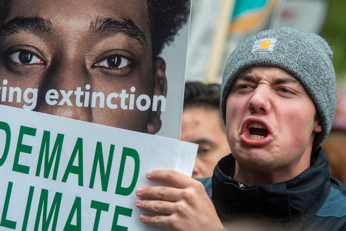 (Rick Egan  |  The Salt Lake Tribune)     Levi Clark chants along with the crowd at Salt Lake City Hall at the Utah Youth Climate Strike.  Hundreds of young people from around the state gathered at the City Building, then marched to the Utah State Capitol, demanding action on the climate crisis. Friday, Sept. 20, 2019.