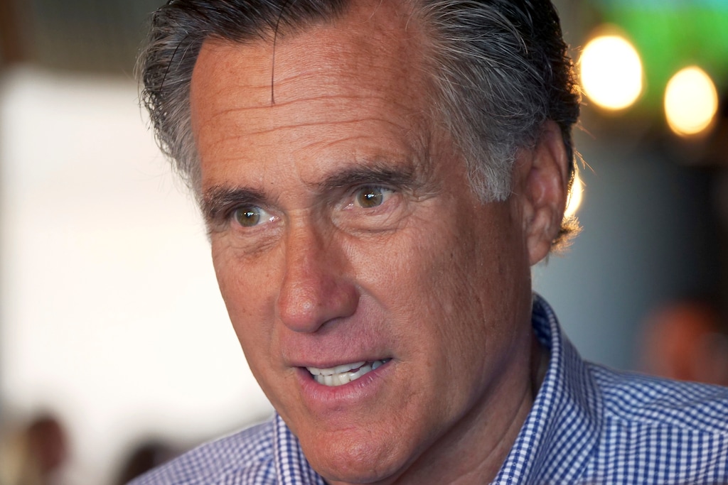 (Rick Bowmer | The Associated Press) In this June 26, 2018 file photo, Mitt Romney speaks with customers during a campaign stop at the R&R BBQ restaurant in South Jordan, Utah. U.S. Senate hopeful Mitt Romney is the marquee name on the Utah ballot this midterm election, but the most compelling race is Democrat Ben McAdams' bid to unseat Republican U.S. Rep. Mia Love and flip the congressional district.