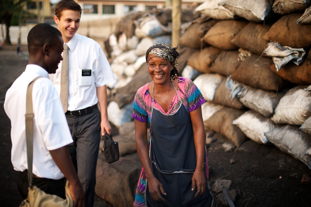 (The Church of Jesus Christ of Latter-day Saints) Missionaries talk to a woman in Ghana.
